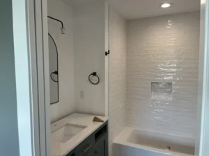 bathroom renovation with new subway tile shower scaled