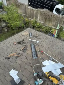 ongoing roof shingle replacement work